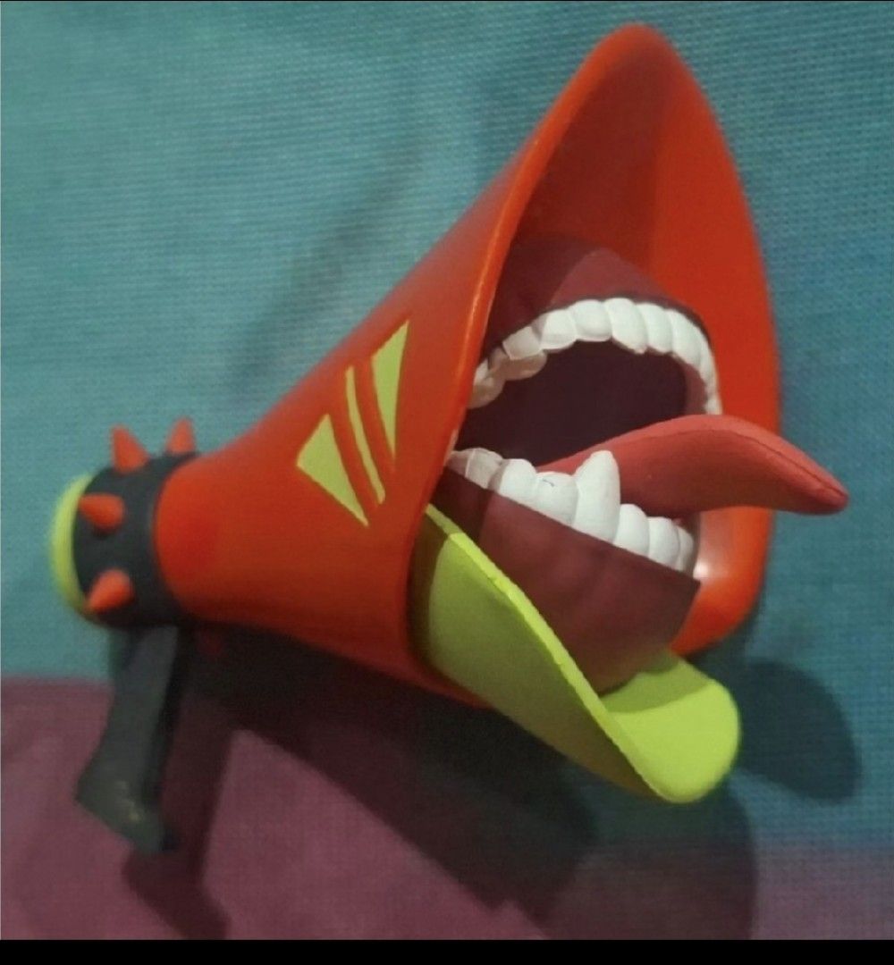 Miku DE:MONSTER Megaphone (Category: Soundbars, Speakers & Amplifiers) located in Arayat. Submitted by collectorboy143 (Listing ID 1469581991, Image 1). Description: - Red megaphone prop with a unique open-mouth design - Features painted white teeth, pink tongue, and green brim details - Cool spike accents around the back ring near the handle - Solid build with a sturdy black handle underneath - Perfect display piece for fans and a great accessor
