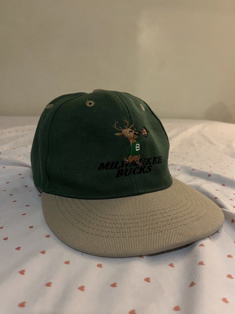 Milwaukee Bucks Embroidered Cap (MAX HeadGear) (Category: Caps & Hats) located in Santa Rosa. Submitted by raimonendai (Listing ID 1469731809, Image 2). Description: - Negotiable - Color: Dark green crown with beige brim and top button - Closure: Adjustable plastic snapback - One size fits all - Bought in Chicago 📍Meetup Sta. Rosa Laguna or Manila .