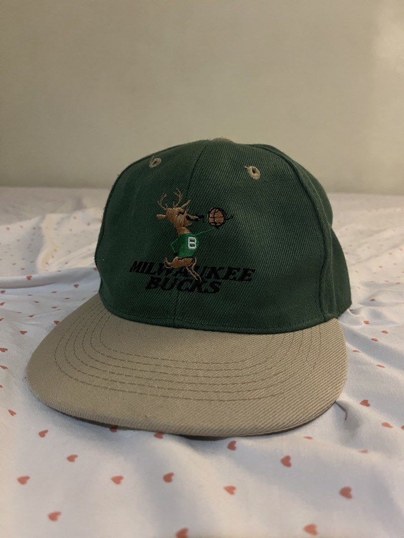 Milwaukee Bucks Embroidered Cap (MAX HeadGear) (Category: Caps & Hats) located in Santa Rosa. Submitted by raimonendai (Listing ID 1469731809, Image 1). Description: - Negotiable - Color: Dark green crown with beige brim and top button - Closure: Adjustable plastic snapback - One size fits all - Bought in Chicago 📍Meetup Sta. Rosa Laguna or Manila .