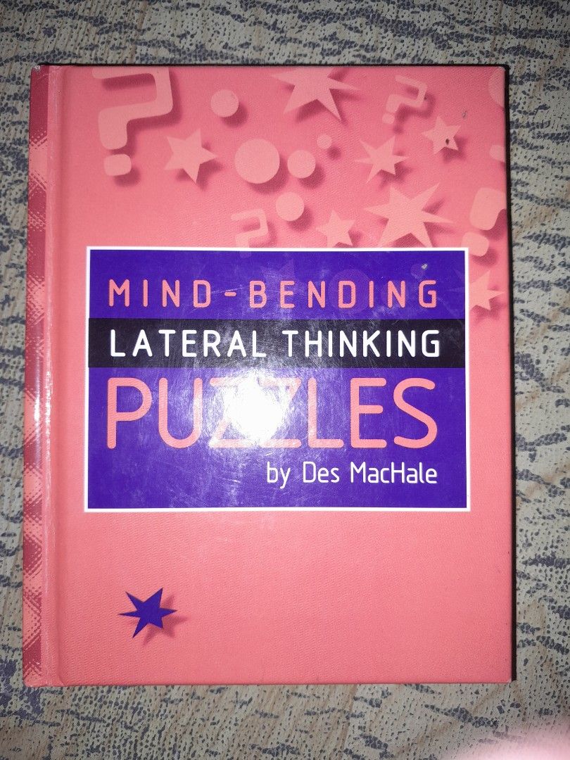 Mind-Bending Lateral Thinking Puzzles by Des MacHale (Category: Storybooks) located in Manila. Submitted by booksljjw (Listing ID 1469614052, Image 1). Description: - Title: Mind-Bending Lateral Thinking Puzzles - Author: Compiled by Des MacHale - Publisher: Lagoon Books, London - Format: Hardcover with a vibrant pink and purple cover - Features: Colourful illustrations, fun riddles, and engaging brain teasers - ISBN: 1-89971-223-2 - Condition/Ap