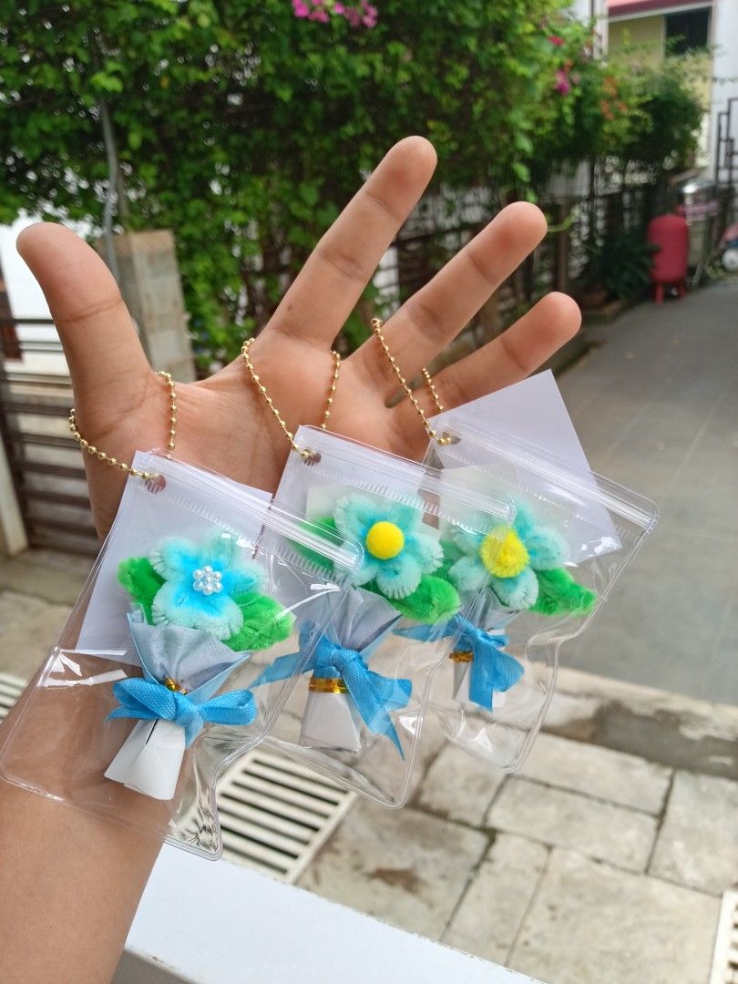 Mini Bouquet Keychain Customized Tags Souvenir (Category: Handmade Craft) located in Davao. Submitted by marianscrafts (Listing ID 1469700695, Image 2). Description: - Handmade mini flower bouquets crafted from colorful pipe cleaners - Beautifully wrapped in miniature paper cones with adorable bows - Ready to use: sealed in a transparent plastic pouch with a gold ball chain - Versatile accessory: ideal for decorating bags, keys, or pouches - Avai