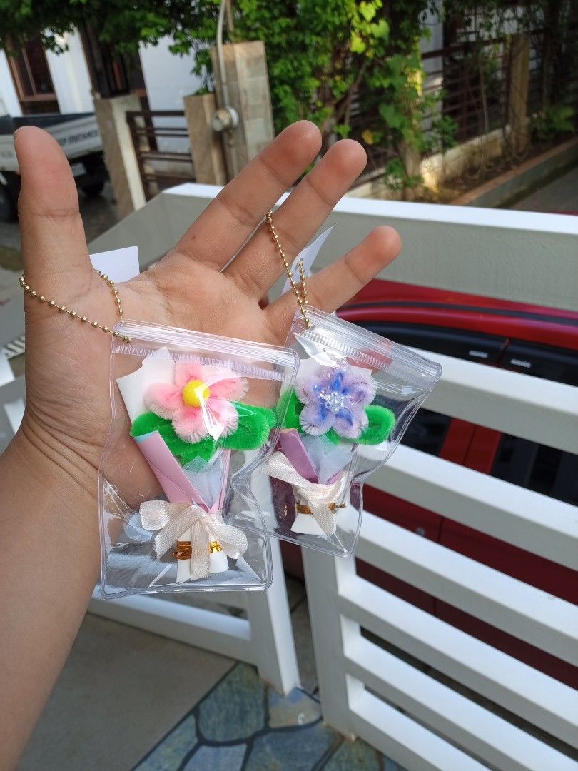 Mini Bouquet Keychain Customized Tags Souvenir (Category: Handmade Craft) located in Davao. Submitted by marianscrafts (Listing ID 1469700695, Image 1). Description: - Handmade mini flower bouquets crafted from colorful pipe cleaners - Beautifully wrapped in miniature paper cones with adorable bows - Ready to use: sealed in a transparent plastic pouch with a gold ball chain - Versatile accessory: ideal for decorating bags, keys, or pouches - Avai