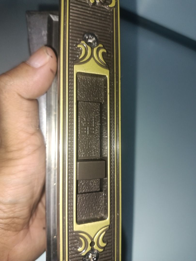 MIWA SL83 Sliding Door Lock Set (Category: Locks, Doors & Gates) located in Munoz. Submitted by larryc1212 (Listing ID 1469682416, Image 3). Description: - Model: MIWA SL83 sliding door lock set - Design: Ornate vintage bronze finish with raised gold floral filigree - Features: Key cylinder lock mechanism and interior sliding latch toggle - Build: Heavy-duty, clean metal edges with clear markings - Condition: Pulled from a door replacement projec