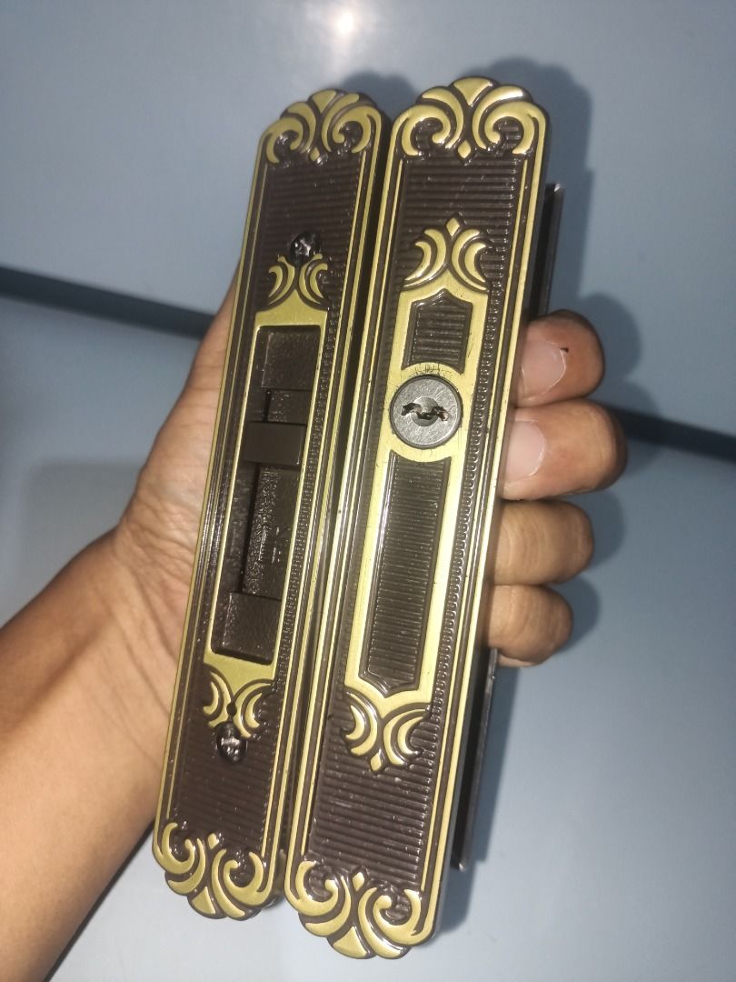 MIWA SL83 Sliding Door Lock Set (Category: Locks, Doors & Gates) located in Munoz. Submitted by larryc1212 (Listing ID 1469682416, Image 1). Description: - Model: MIWA SL83 sliding door lock set - Design: Ornate vintage bronze finish with raised gold floral filigree - Features: Key cylinder lock mechanism and interior sliding latch toggle - Build: Heavy-duty, clean metal edges with clear markings - Condition: Pulled from a door replacement projec