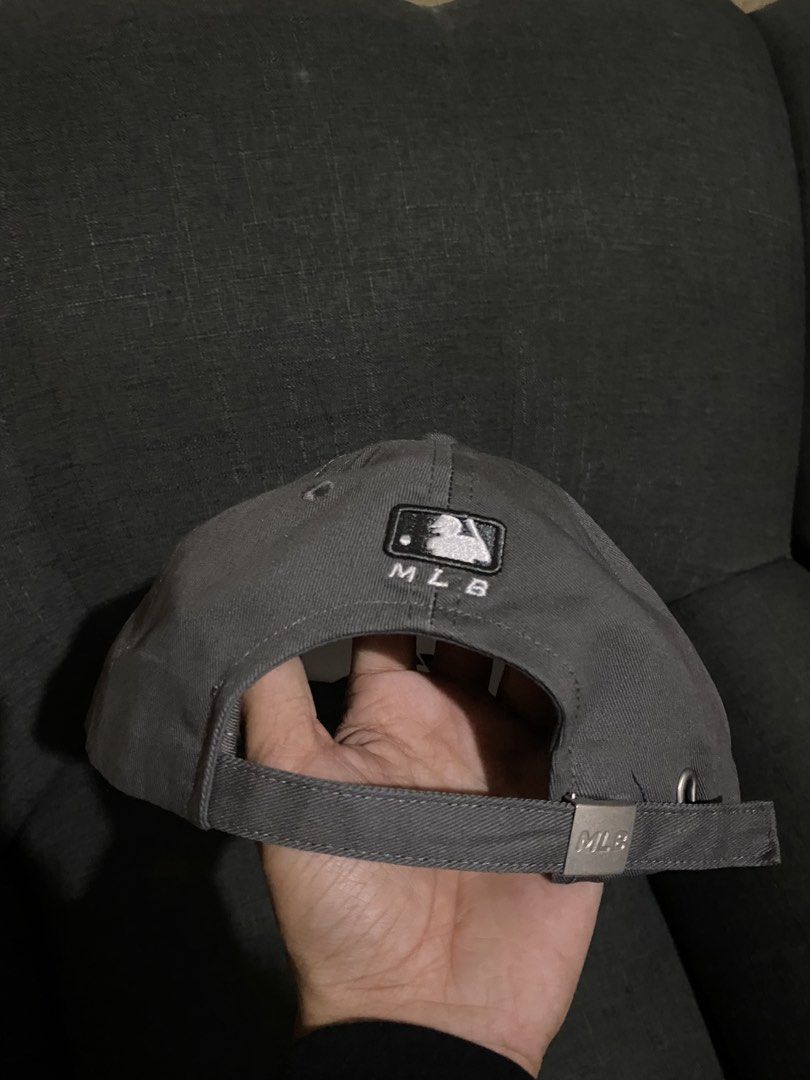 MLB New York Yankees Grey Cap Hat (Category: Caps & Hats) located in Bulacan. Submitted by _myarchive (Listing ID 1469672421, Image 2). Description: - Brand: MLB New York Yankees - Color: Grey with white embroidered logo - Details: MLB logo patch on back, adjustable metal buckle with MLB stamp - Condition: Brand new, unworn with original cardboard insert and interior tags intact.