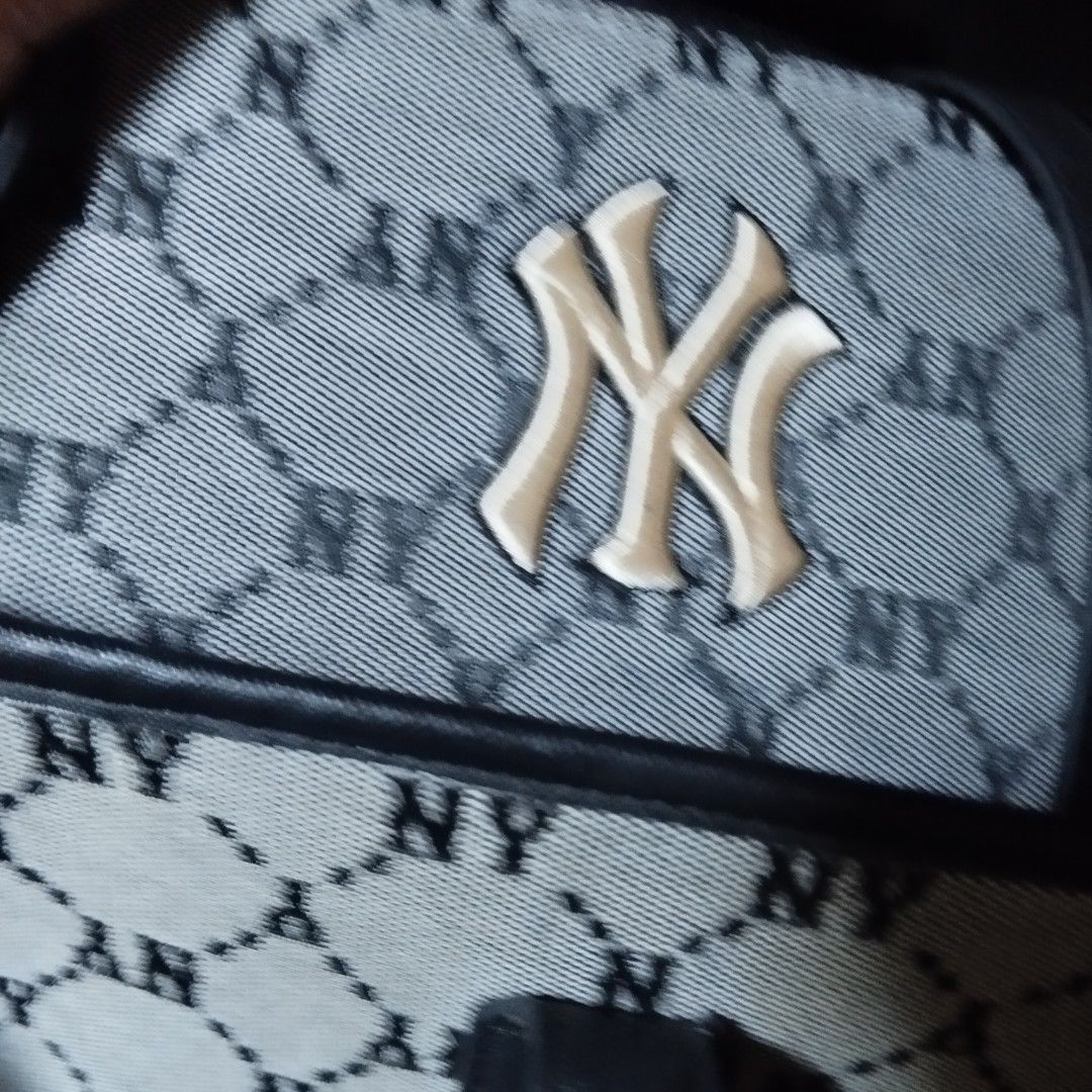 MLB New York Yankees Monogram Tote Bag (Category: Tote Bags) located in Manila. Submitted by lene48 (Listing ID 1469593854, Image 1). Description: -MLB New York Yankees tote bag - Stylish grey and black all-over monogram print with bold raised NY front logo - Durable black faux leather top handles and reinforced corner patches - Roomy and structured interior, perfect for daily use - Includes official MLB branding and authentication tag (2021).
