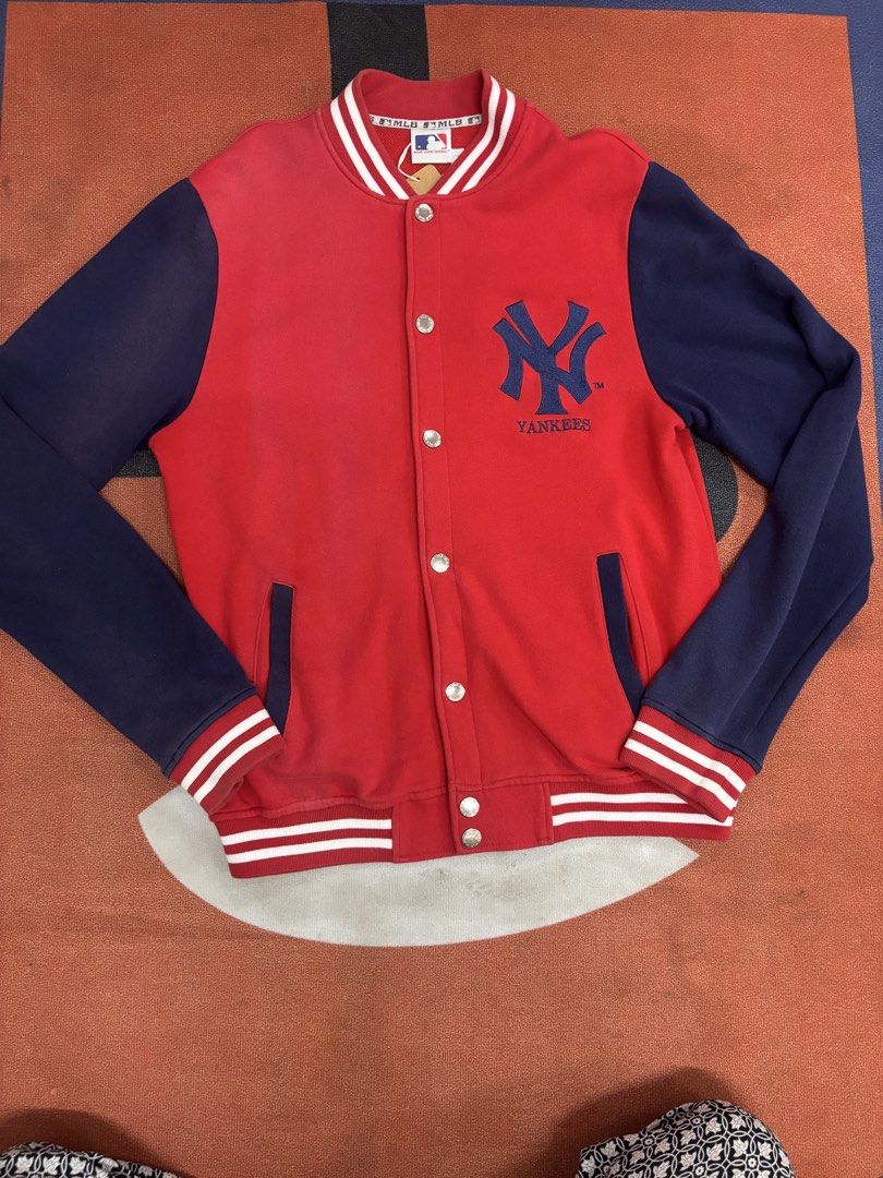 MLB New York Yankees Varsity Jacket Red Blue Size L (Category: Coats, Jackets and Outerwear) located in Alicia. Submitted by thriftbagph (Listing ID 1469758633, Image 3). Description: - Official MLB New York Yankees merchandise - Color: Red body with dark blue sleeves - Features embroidered team logo on the chest - Classic snap-button front closure - Stylish striped ribbed collar, cuffs, and hem - Size: Medium- Large Body Frame - Great casual out