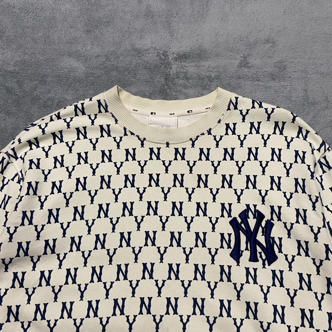 MLB NY AOP Monogram Sweater (Category: Hoodies) located in Cavite. Submitted by kali_galleria (Listing ID 1469691397, Image 3). Description: Available 🏷️ MLB NY AOP Monogram 💎 (Beige & Navy blue) • Excellent Condition: 9.8 • Color rate: 9.8 • Width: 22-23 • Length: 27 • Best Fit: L-XL • Issue: 🏷️700 + SF “Thrift with your fingertip👆🏼”.