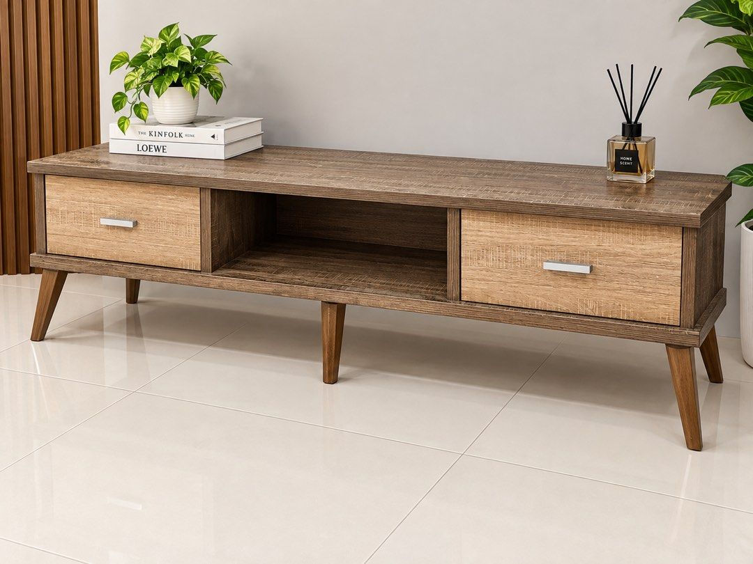 Modern Wood TV Console Media Unit 1.5m (Category: TV Consoles) located in Las Pinas. Submitted by shop.eo.home (Listing ID 1469608012, Image 1). Description: - Type: Wooden TV console - Dimensions: ~1.5m (L) x 40cm (W) x 45cm (H) - Storage: 2 sliding drawers with lighter wood grain fronts and silver handles, plus an open middle shelf - Design: Rustic brown finish supported by sturdy angled legs - Condition: Good, ideal for most living rooms and e