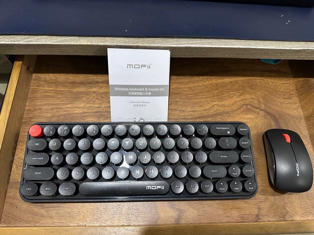 Mofii Wireless Keyboard and Mouse Set (Category: Computer Keyboard) located in Makati City. Submitted by randombloggingstuff (Listing ID 1469400551, Image 1). Description: Used twice only Original price is around 800. Free batteries included No box Black Mofii wireless keyboard and matching mouse combo. Retro typewriter style with round keycaps. Distinctive red escape key. Compact layout with full number row and navigation cluster. Clean matte fi