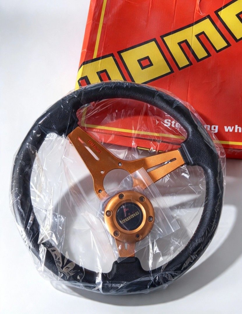 MOMO SPORT STEERING WHEEL (Category: Body Parts and Accessories) located in Baguio. Submitted by ebxst.thrift (Listing ID 1469611333, Image 2). Description: MOMO SPORT STEERING WHEEL •New •MOMO Drifting Series steering wheel, featuring an orange/gold.