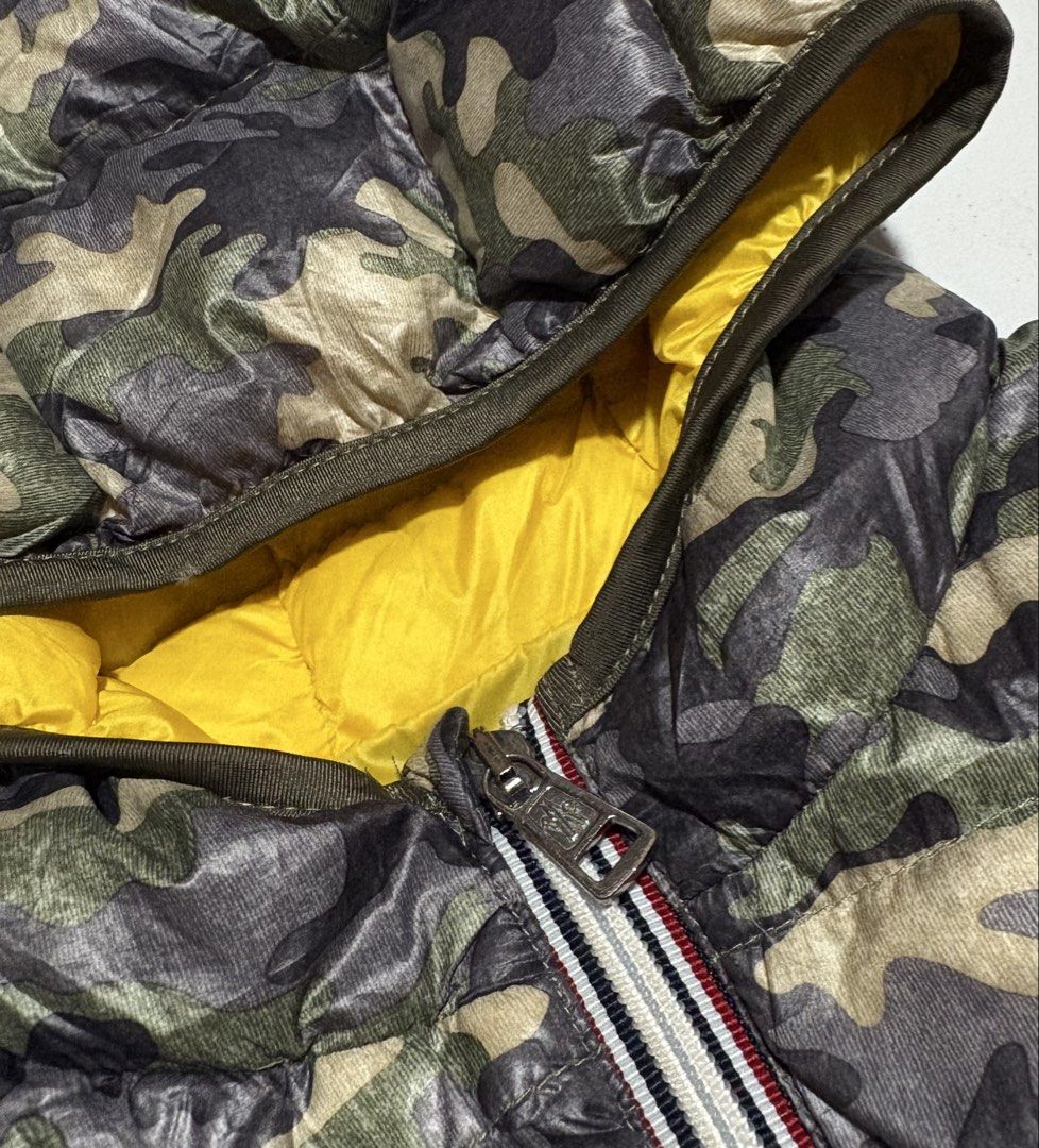 Moncler Armoise Camouflage Down Puffer Vest (Category: Vests) located in Baguio. Submitted by thriftedbaguio (Listing ID 1469622846, Image 3). Description: Excellent Condition Size 4 Tagged Dimension 16*22 Color rate 10 .