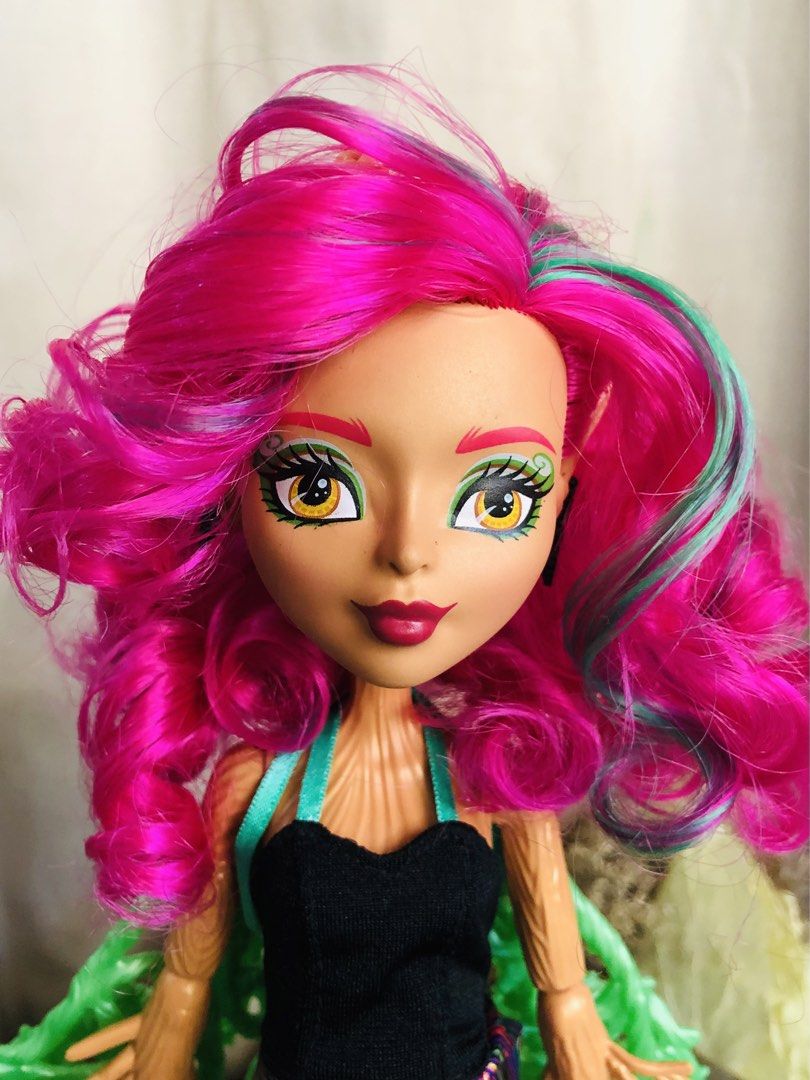 Monster High Garden Ghouls TREESA THORNWILLOW (Category: Kids Toys) located in Manila. Submitted by queen_princess.collections (Listing ID 1469581983, Image 3). Description: - Sold as is - Tight joints - 14.5-inch tree monster doll - Includes tree trunk playset base that transforms into a display stand - Bright pink and teal hair with unique woody textured limbs and tree-branch arm extensions - Detailed outfit featuring a stylish patterned skirt 