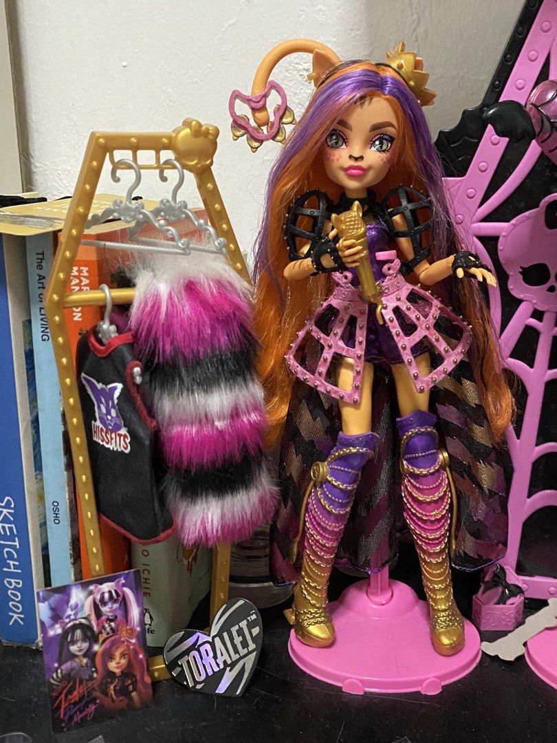 Monster High Hissfits Toralei Stripe (HTF) (Category: Kids Toys) located in Manila. Submitted by rei_19 (Listing ID 1469752282, Image 3). Description: Monster High Hissfits Toralei Stripe🧡(HTF) 2k only. can give lp if get asap She’s from the Hissfits three pack. Good condition✅ - Displayed only Includes all her accessories✅ - microphone, tambourine, free stand, and hissfits picture NOTE: nawala na yung chest piece niya (last photo) repainted/tou