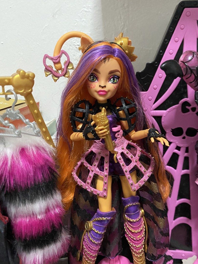 Monster High Hissfits Toralei Stripe (HTF) (Category: Kids Toys) located in Manila. Submitted by rei_19 (Listing ID 1469752282, Image 1). Description: Monster High Hissfits Toralei Stripe🧡(HTF) 2k only. can give lp if get asap She’s from the Hissfits three pack. Good condition✅ - Displayed only Includes all her accessories✅ - microphone, tambourine, free stand, and hissfits picture NOTE: nawala na yung chest piece niya (last photo) repainted/tou
