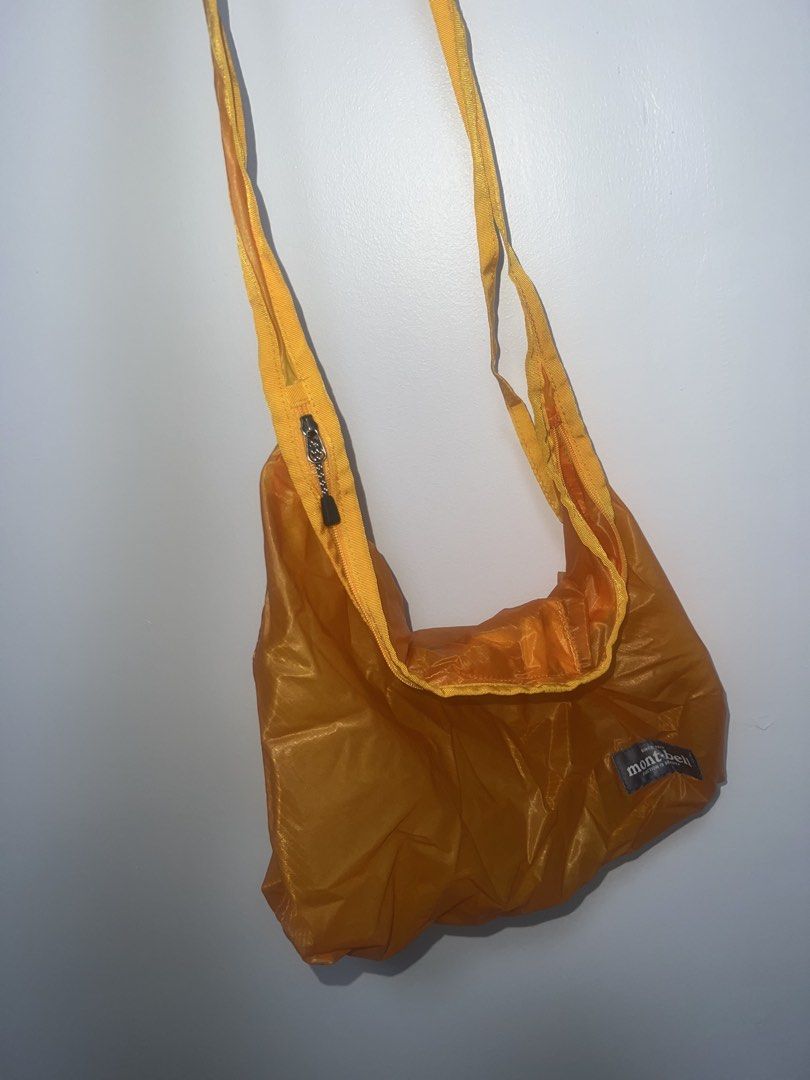 Mont-bell Orange Lightweight Nylon Bag (Category: Sling Bags) located in Paranaque City. Submitted by wednesday___ (Listing ID 1469591659, Image 1). Description: - Brand: Mont-bell - Color: Bright orange - Material: Ultra-lightweight ripstop nylon - Features: Secure top zipper closure, simple crossbody strap, branded patch detail - Portability: Packs down super small when not in use - Best for: Everyday errands and hiking trips.
