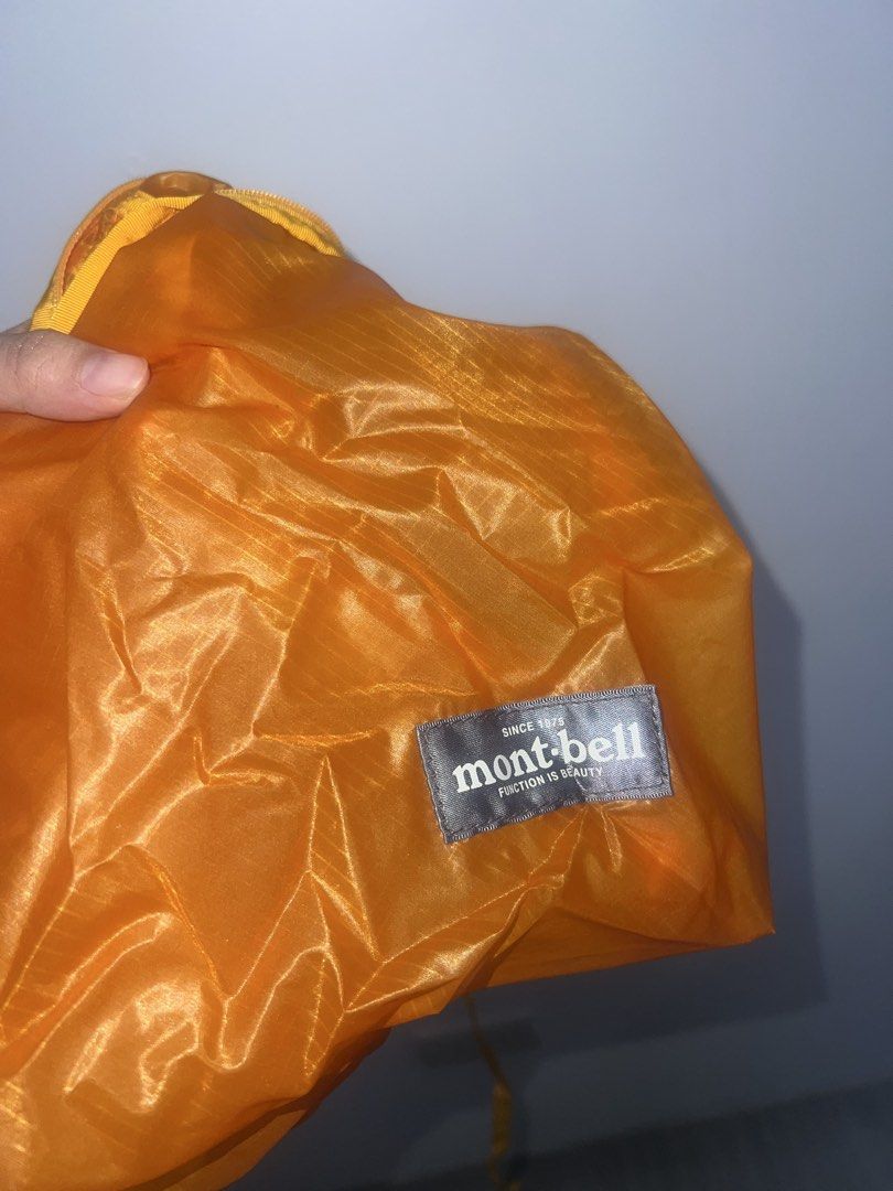 Mont-bell Orange Lightweight Nylon Bag (Category: Sling Bags) located in Paranaque City. Submitted by wednesday___ (Listing ID 1469591659, Image 3). Description: - Brand: Mont-bell - Color: Bright orange - Material: Ultra-lightweight ripstop nylon - Features: Secure top zipper closure, simple crossbody strap, branded patch detail - Portability: Packs down super small when not in use - Best for: Everyday errands and hiking trips.