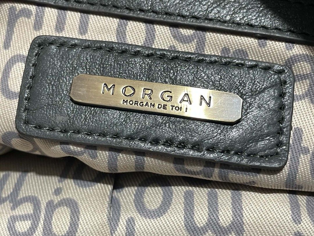 Morgan de toi grey leather handbag (Category: Luxury Bags & Wallets) located in Manila. Submitted by buyingprelovedukayukay (Listing ID 1469586199, Image 3). Description: - Brand: Morgan de toi - Color: Sleek grey - Style: Slouchy everyday handbag - Storage: Multiple exterior zip pockets with chic tassel pullers, plus interior zip and slip pockets - Hardware: Premium metallic details - Straps: Dual top carry handles + adjustable and detachable sh