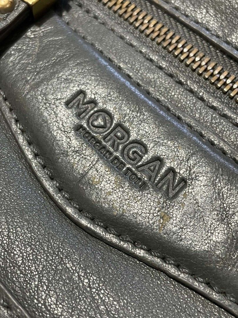 Morgan de toi grey leather handbag (Category: Luxury Bags & Wallets) located in Manila. Submitted by buyingprelovedukayukay (Listing ID 1469586199, Image 2). Description: - Brand: Morgan de toi - Color: Sleek grey - Style: Slouchy everyday handbag - Storage: Multiple exterior zip pockets with chic tassel pullers, plus interior zip and slip pockets - Hardware: Premium metallic details - Straps: Dual top carry handles + adjustable and detachable sh