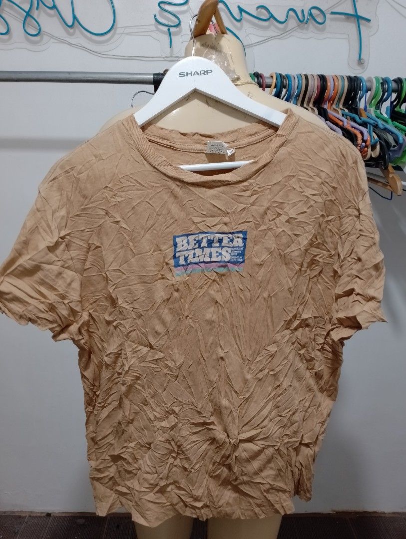 Moussy Better Times Graphic Tee Tan Brown (Category: Luxury Apparel) located in Manila. Submitted by gentlephoenix.151206 (Listing ID 1469581147, Image 1). Description: - Brand: Moussy - Color: Tan brown - Size: Free size (Standard fit) - Material: 100% cotton with intentional wrinkled texture treatment - Design: 'Better Times' small text on front, large magazine theme photo collage on back - Neckline: Crew neck - Condition: Brand new / Excellent