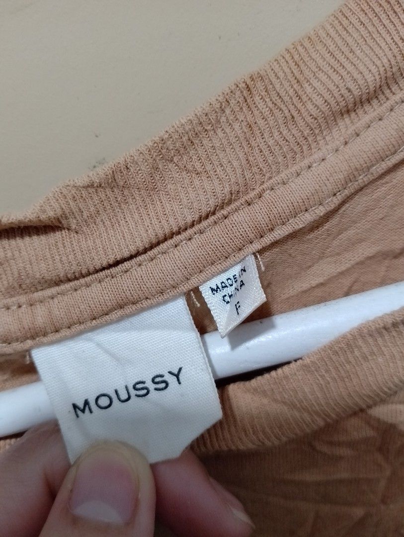 Moussy Better Times Graphic Tee Tan Brown (Category: Luxury Apparel) located in Manila. Submitted by gentlephoenix.151206 (Listing ID 1469581147, Image 2). Description: - Brand: Moussy - Color: Tan brown - Size: Free size (Standard fit) - Material: 100% cotton with intentional wrinkled texture treatment - Design: 'Better Times' small text on front, large magazine theme photo collage on back - Neckline: Crew neck - Condition: Brand new / Excellent