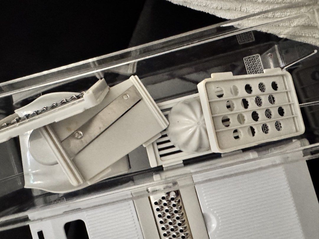 Multi-Function Kitchen Slicer Grater Set with Container (Category: Knives & Chopping Boards) located in Pasay City. Submitted by margucci_0823 (Listing ID 1469586191, Image 2). Description: - All-in-one kitchen tool for slicing, grating, and juicing - Includes clear storage container, main lid with grater insert, and citrus juicer attachment - Comes with multiple interchangeable blades for versatile meal prep - Compact design that saves cabinet s