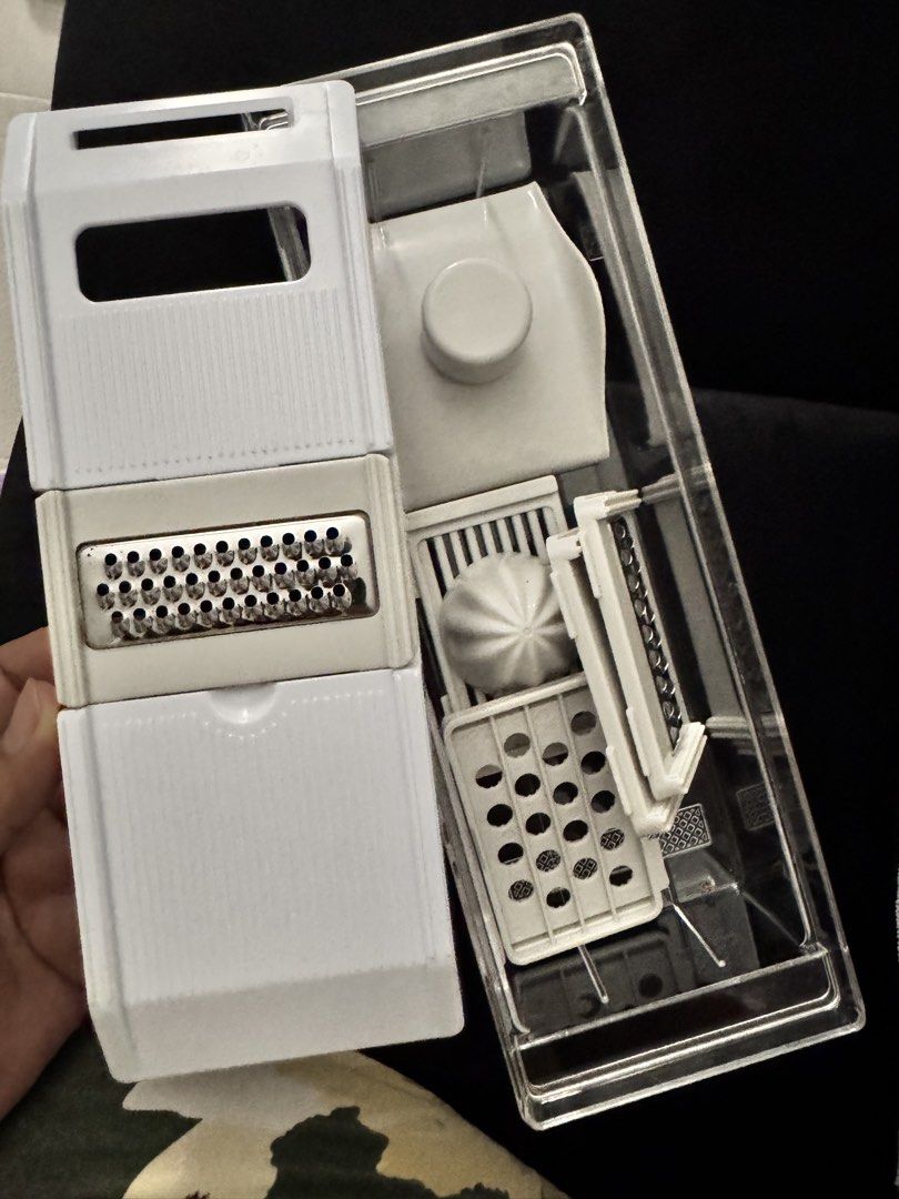 Multi-Function Kitchen Slicer Grater Set with Container (Category: Knives & Chopping Boards) located in Pasay City. Submitted by margucci_0823 (Listing ID 1469586191, Image 3). Description: - All-in-one kitchen tool for slicing, grating, and juicing - Includes clear storage container, main lid with grater insert, and citrus juicer attachment - Comes with multiple interchangeable blades for versatile meal prep - Compact design that saves cabinet s