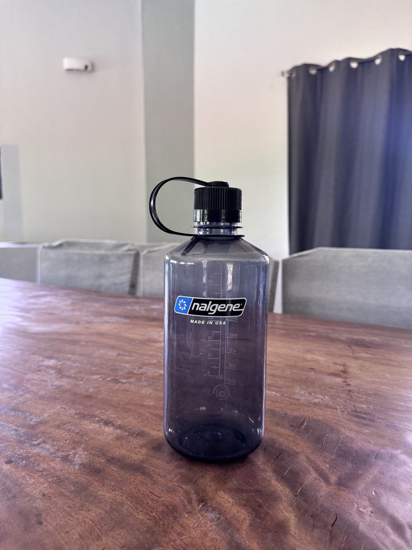 Nalgene Slate Blue Water Bottle (Category: Water Bottles & Tumblers) located in Carmen. Submitted by t1torref (Listing ID 1469611898, Image 1). Description: - Authentic Nalgene water bottle made in USA - Color: Dark Slate Blue with black screw cap and loop strap - Classic narrow mouth design for easy sipping - Features volume markings in ounces and millilitres - Highly durable plastic construction - Versatile for daily hydration, gym, hiking, or 
