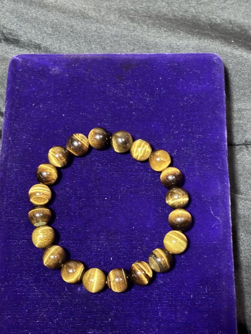 Natural Tiger Eye Gemstone Beaded Bracelet (Category: Bracelets) located in Caloocan City. Submitted by berndale_closet (Listing ID 1469608932, Image 1). Description: - Material: Genuine brown and gold tiger eye crystal beads - Finish: Smooth polished round stones with natural chatoyant shimmer - Fit: Comfortable stretchy cord that fits standard wrist sizes - Style: Versatile daily accessory, perfect for crystal lovers and casual wear.