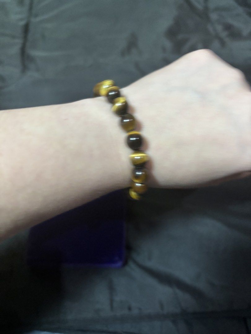 Natural Tiger Eye Gemstone Beaded Bracelet (Category: Bracelets) located in Caloocan City. Submitted by berndale_closet (Listing ID 1469608932, Image 2). Description: - Material: Genuine brown and gold tiger eye crystal beads - Finish: Smooth polished round stones with natural chatoyant shimmer - Fit: Comfortable stretchy cord that fits standard wrist sizes - Style: Versatile daily accessory, perfect for crystal lovers and casual wear.