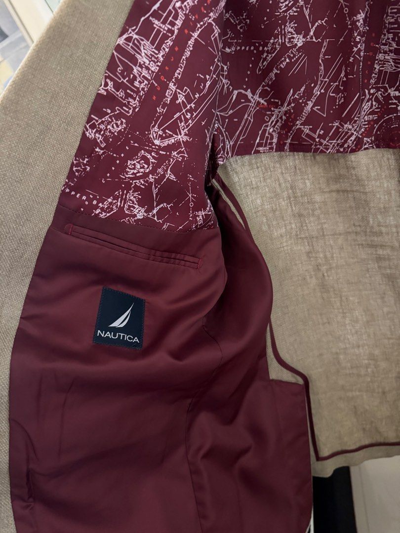 Nautica Beige Blazer Size 44R (Category: Coats, Jackets and Outerwear) located in Taguig. Submitted by dependingonvibe (Listing ID 1469620235, Image 3). Description: - Brand: Nautica - Color: Beige - Size: 44R (fits XL. American size) - Lining: Unique dark red map pattern - Features: Interior pockets and lapel pin - Condition: Clean and ready to wear - Versatility: Perfect for formal events or smart-casual outings Bought in USA. .