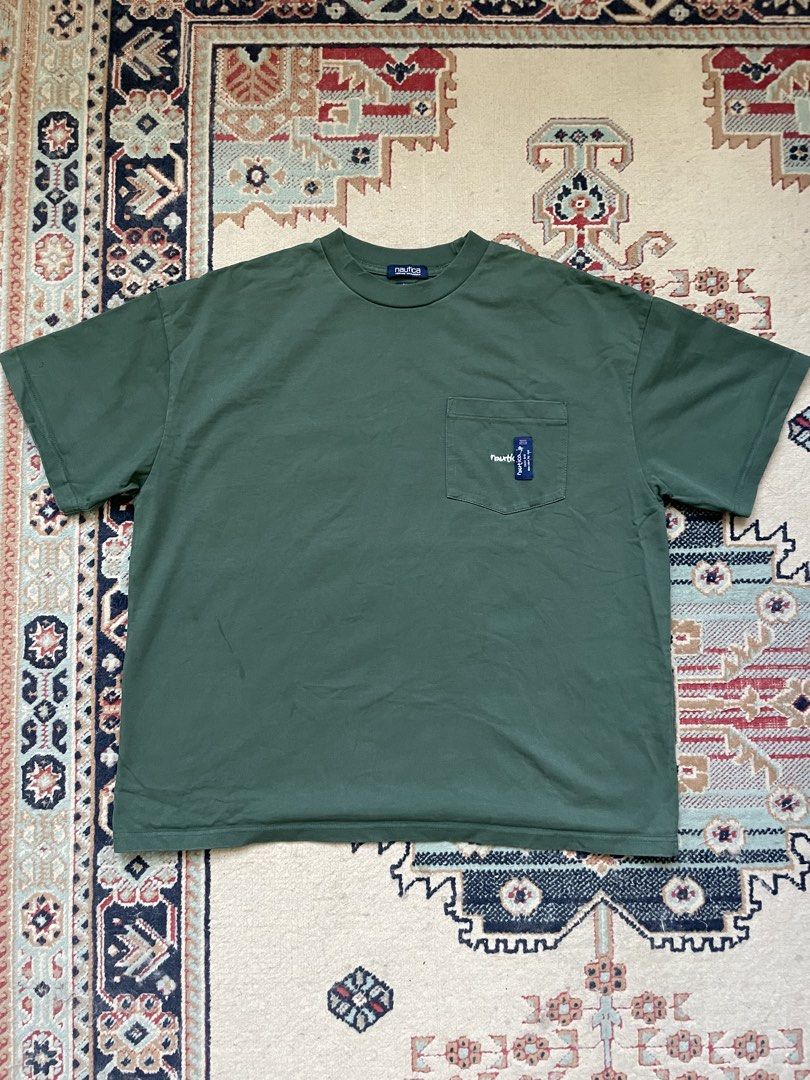 Nautica Pocket T-Shirt (Category: Tshirts & Polo Shirts ) located in Pasig City. Submitted by erzvgo (Listing ID 1469638681, Image 1). Description: Nautica Vintage Collection tee in dark green Size Large, boxy fit Single chest pocket with embroidered logo detailing and blue tag accent. Heavy cotton material. Buyer handles delivery from Makati.