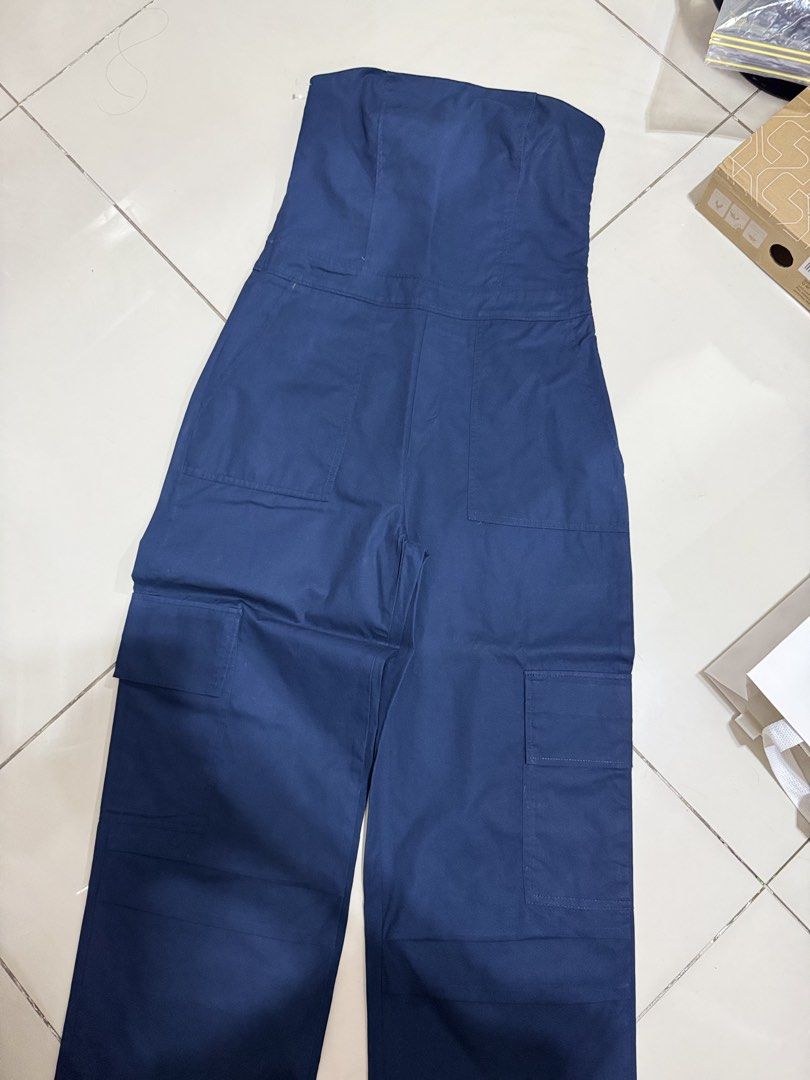Navy Blue Strapless Cargo Jumpsuit | Clothes for Breakfast (Category: Jumpsuits) located in Manila. Submitted by buymiclothes.47 (Listing ID 1469740066, Image 2). Description: Navy Blue Strapless Cargo Jumpsuit | Clothes for Breakfast Preloved navy blue strapless cargo jumpsuit from a local brand * Color: Navy blue * Strapless, fitted bodice * Wide-leg silhouette * Utility-style pockets * Altered for a better fit, so please request measurements b