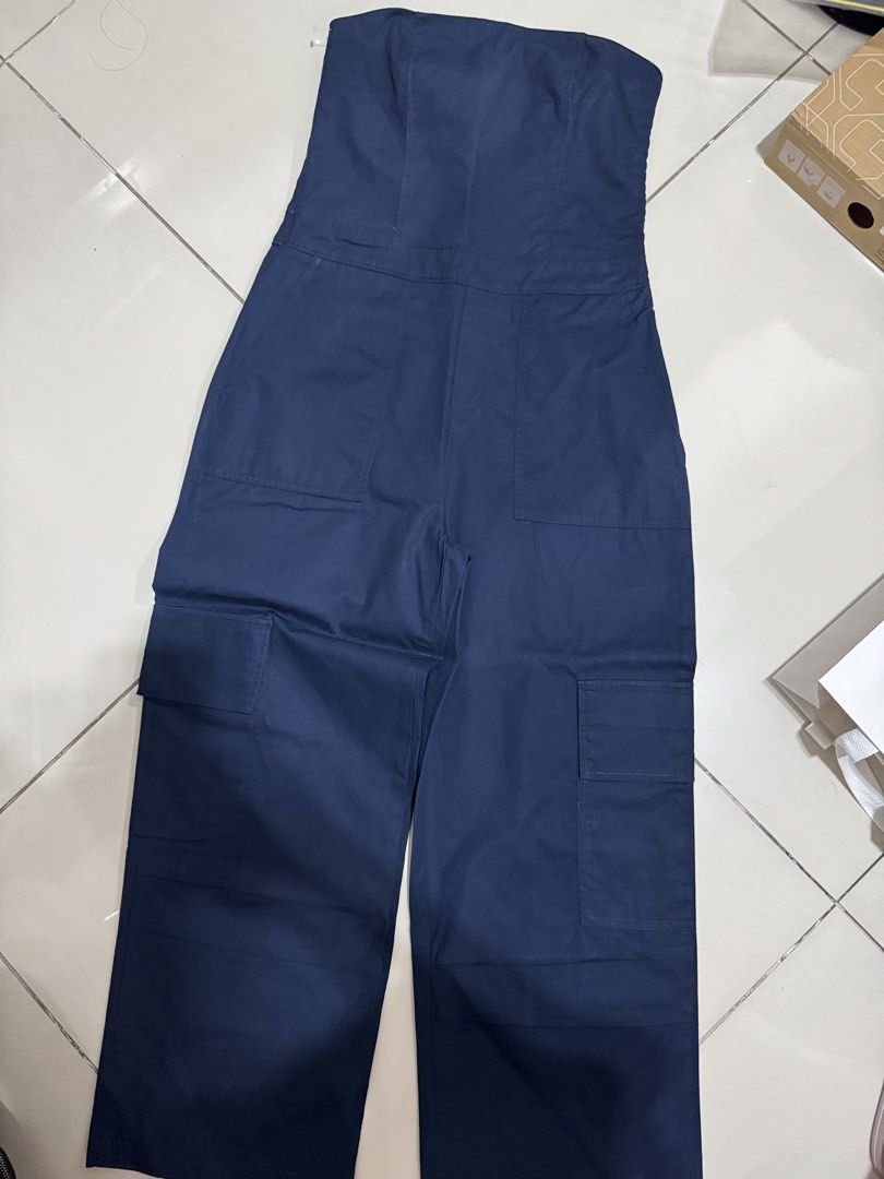 Navy Blue Strapless Cargo Jumpsuit | Clothes for Breakfast (Category: Jumpsuits) located in Manila. Submitted by buymiclothes.47 (Listing ID 1469740066, Image 1). Description: Navy Blue Strapless Cargo Jumpsuit | Clothes for Breakfast Preloved navy blue strapless cargo jumpsuit from a local brand * Color: Navy blue * Strapless, fitted bodice * Wide-leg silhouette * Utility-style pockets * Altered for a better fit, so please request measurements b