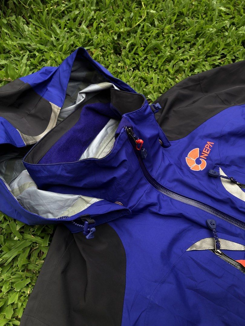 NEPA Blue and Black Outdoor Jacket Size 100 (Category: Coats, Jackets and Outerwear) located in Kabasalan. Submitted by hamugaway (Listing ID 1469631225, Image 2). Description: - Brand: NEPA - Color: Blue and black with orange contrast details - Size: 100 on tag - Features: Hooded design, multiple chest and body zip pockets, adjustable velcro sleeve cuffs - Branding: NEPA logos on the chest and sleeve - Origin: Made in Vietnam - 22.5x27.