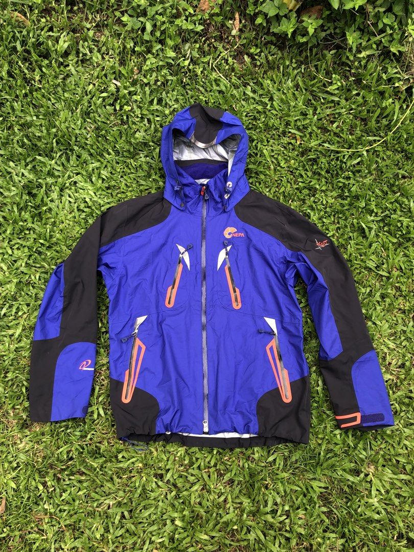 NEPA Blue and Black Outdoor Jacket Size 100 (Category: Coats, Jackets and Outerwear) located in Kabasalan. Submitted by hamugaway (Listing ID 1469631225, Image 1). Description: - Brand: NEPA - Color: Blue and black with orange contrast details - Size: 100 on tag - Features: Hooded design, multiple chest and body zip pockets, adjustable velcro sleeve cuffs - Branding: NEPA logos on the chest and sleeve - Origin: Made in Vietnam - 22.5x27.
