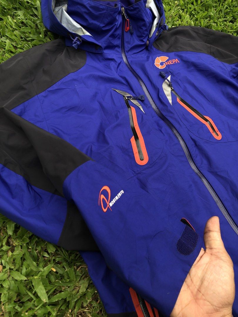 NEPA Blue and Black Outdoor Jacket Size 100 (Category: Coats, Jackets and Outerwear) located in Kabasalan. Submitted by hamugaway (Listing ID 1469631225, Image 3). Description: - Brand: NEPA - Color: Blue and black with orange contrast details - Size: 100 on tag - Features: Hooded design, multiple chest and body zip pockets, adjustable velcro sleeve cuffs - Branding: NEPA logos on the chest and sleeve - Origin: Made in Vietnam - 22.5x27.
