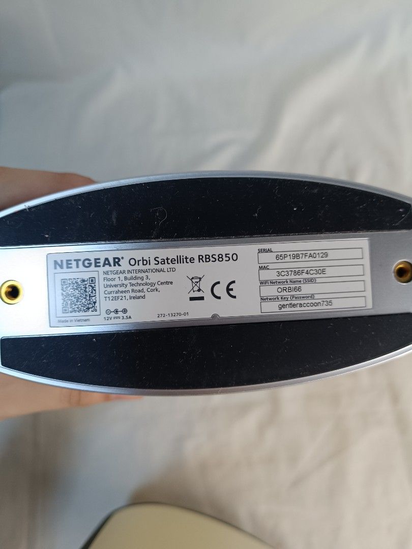 Netgear Orbi Satellite RBS850 (Category: Networking) located in Baguio. Submitted by clothes.over.bros.ph_2020 (Listing ID 1469596093, Image 3). Description: SOLD AS SET - Model: Netgear Orbi Satellite RBS850 - Color: White finish with a sleek silver base - Connectivity: 4 Gigabit ethernet ports on the back panel - Features: Standard power input port and physical reset button - Details: Serial number and MAC address intact on bottom label - Condi