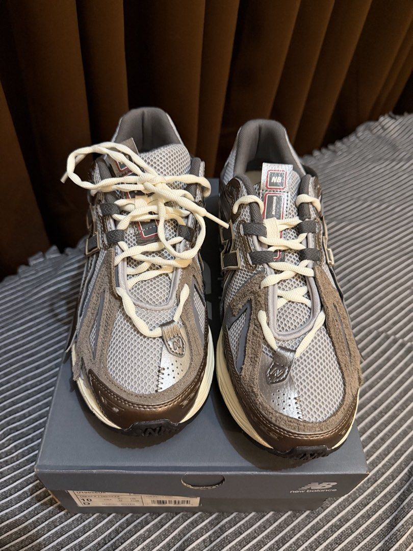 New Balance 1906A Grey Bronze (Category: Casual Shoes) located in Mandaluyong City. Submitted by marcomaligaya_ (Listing ID 1469587064, Image 2). Description: - Model: New Balance 1906A (Grey/Bronze) - Size: US 10 / UK 9.5 / EU 44 - Condition: Brand new, never worn, pristine out-of-box condition - Design: Chunky retro runner with distressed suede overlays, mesh base, and cream laces - Inclusions: Complete with original dark grey box.
