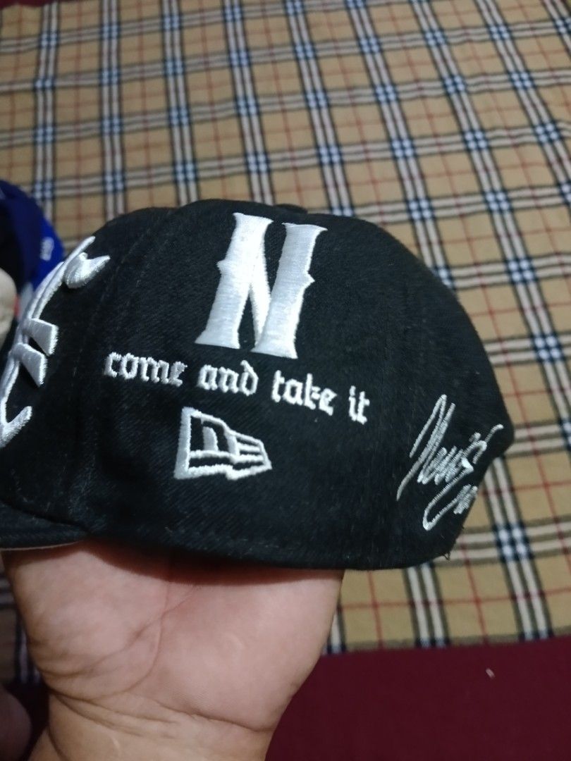 New Era 9Fifty Black Snapback Cap (Category: Caps & Hats) located in General Santos City (Dadiangas). Submitted by freehorse.5f2a61 (Listing ID 1469629288, Image 2). Description: - Brand: New Era 9Fifty - Style: Snapback hat (Size: Small-Medium) - Color: Black - Embroidery: 'NENY', 'come and take it', 'battle born since 27', and American flag on the side - Closure: Adjustable snap back - Condition: Brand new.