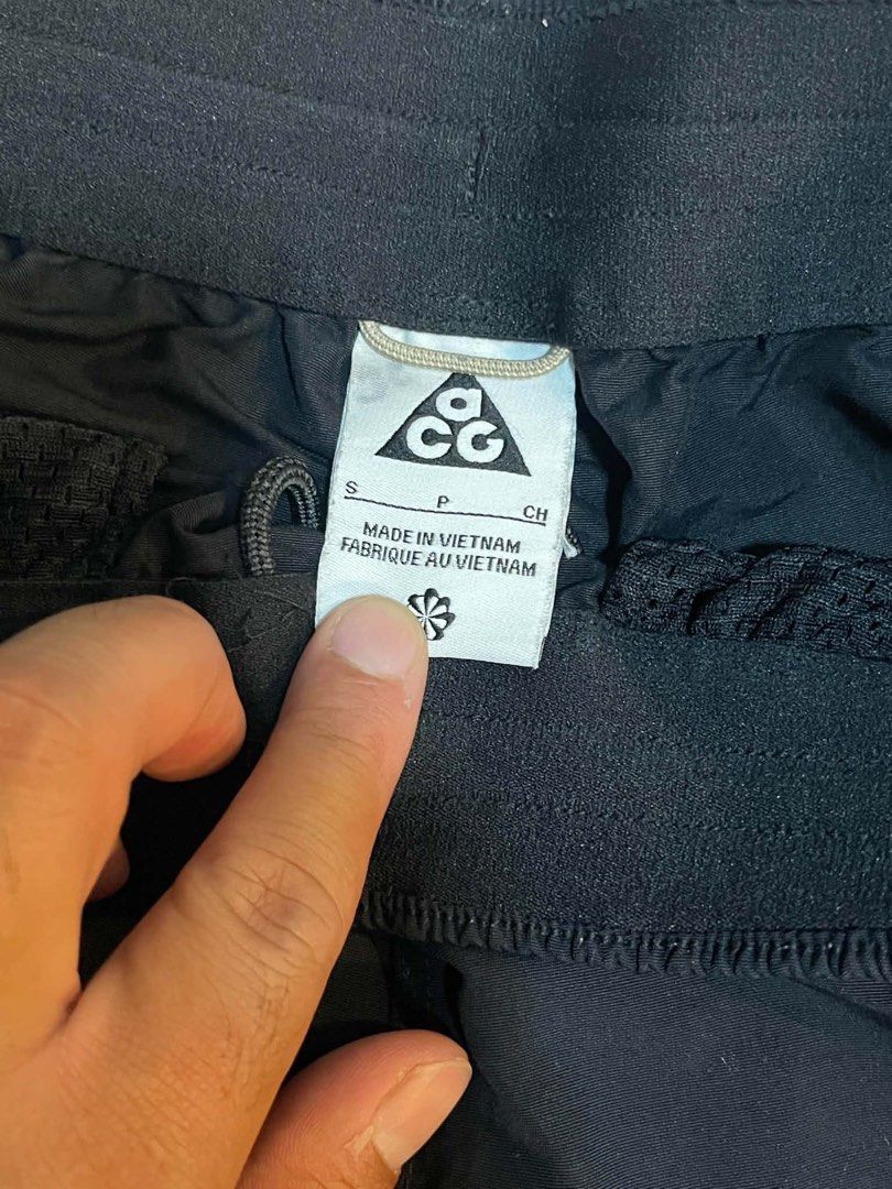 Nike ACG Black Utility Shorts Size S (Category: Shorts) located in Manila. Submitted by jstash09 (Listing ID 1469678398, Image 2). Description: - Brand: Nike ACG - Color: Black - Size: S - Waistband: Elastic with adjustable drawcord - Pockets: Side pockets with secure zippers - Extras: Small D-ring attachment near the waist and iconic ACG triangle logo near the hem - Origin: Made in Vietnam - Condition: Clean overall, minimal wear observed.
