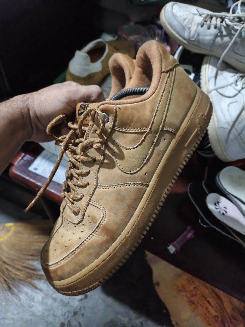 Nike Air Force 1 Flax Wheat Size US 11 (Category: Sneakers) located in Imus. Submitted by grindhouse.thriftshop (Listing ID 1469703053, Image 1). Description: Nike Air Force 1 low top sneakers in wheat flax colorway. Iconic gum sole with classic circular tread pattern. Size US 11, UK 10, EUR 45, cm 29. Style code CJ9179-200. Suede leather upper with matching laces and padded collar. Made in China. Noticeable creasing on toe boxes and general wear