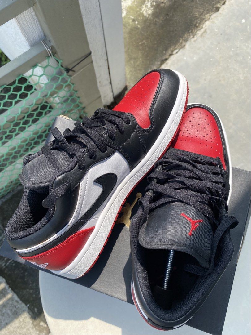 Nike Air Jordan 1 Low Bred Toe (Category: Sneakers) located in Quezon City. Submitted by ra.collezione (Listing ID 1469602614, Image 1). Description: - Model: Nike Air Jordan 1 Low Bred Toe - Colorway: Black, white, and red leather - Branding: Embroidered Jumpman logo on the tongue - Inclusions: Original laces, shoebox, and shoe trees - Size 8.