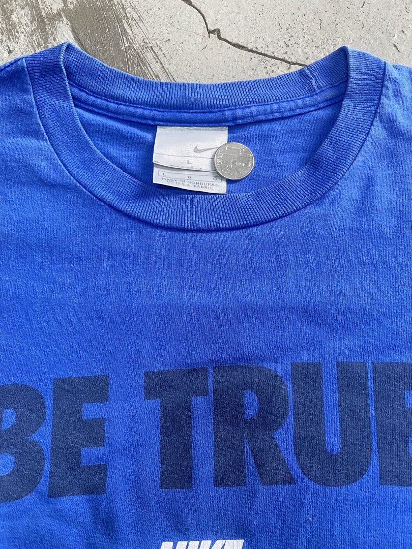 Nike Be True T-Shirt Blue Size L (Category: Tshirts & Polo Shirts ) located in Manila. Submitted by chotcarl (Listing ID 1469756249, Image 2). Description: - Brand: Nike - Style: Be True graphic tee - Color: Bright blue with black and white print - Size: Large - Details: Minor cracking on the white Nike print, small basketball graphic near the text - Material: Made in Honduras of U.S.A. fabric - Condition: Good, classic casual streetwear piece.