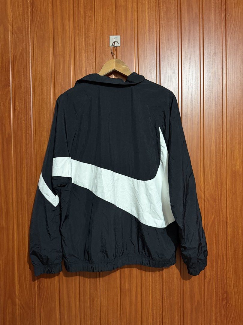 Nike Big Swoosh Black White Windbreaker Jacket (Category: Coats, Jackets and Outerwear) located in Manila. Submitted by tlfph (Listing ID 1469690742, Image 3). Description: - Brand: Nike - Item: Black and White Windbreaker Jacket - Size: Medium - Design: Iconic huge wrap-around Swoosh logo on chest and back - Material: Lightweight outer with breathable mesh inner lining - Features: Zip-up front, attached hood, elastic cuffs and hem - Origin: Made