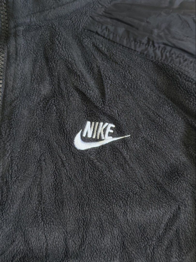 Nike Black Sherpa Fleece 1/4 Zip Pullover (Category: Coats, Jackets and Outerwear) located in Cavite. Submitted by remcadzzz (Listing ID 1469609908, Image 2). Description: - Brand: Nike - Style: Sherpa Fleece Half-Zip Sweatshirt - Style Code: DD4870-010 - Color: Black with white embroidered chest logo - Size: Small on tag but best fit M to Semi Large - Origin: Made in Vietnam - Features: Front kangaroo pocket, super cozy and warm material ideal f
