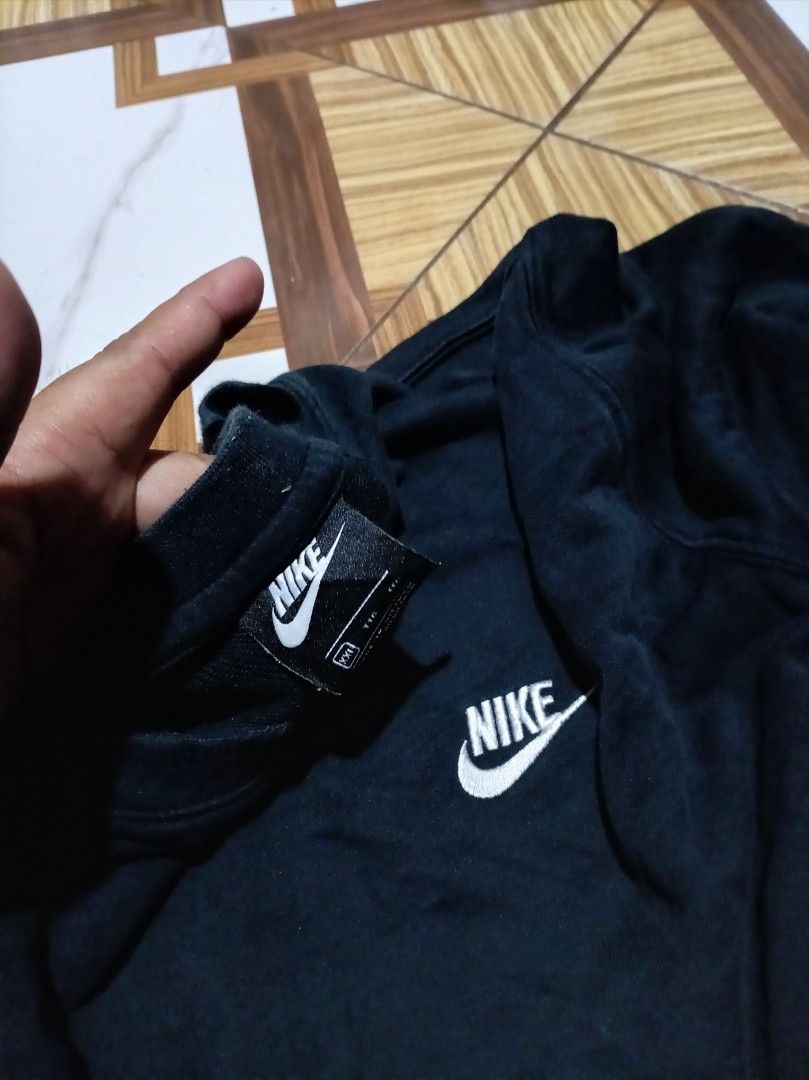 Nike Black Sweatshirt XXL (Category: Coats, Jackets and Outerwear) located in Naga. Submitted by catimbange25697 (Listing ID 1469713222, Image 3). Description: - Brand: Nike - Color: Black with white embroidered swoosh logo - Size: XXL (Chest 110cm, 185/100A) - Material: 80% Cotton, 20% Polyester - Origin: Made in Vietnam - Condition: Excellent everyday pullover with long sleeves and crew neck design W24 L28inches .