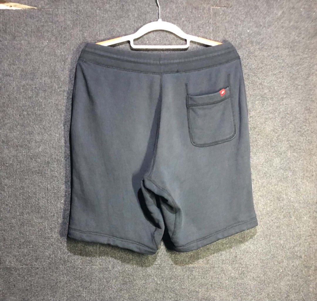 Nike Black Sweatshorts with Drawstring (Category: Shorts) located in Manila. Submitted by thriftnipaps (Listing ID 1469686945, Image 2). Description: - Color: Classic Black - Brand: Nike with embroidered small white swoosh on the left leg - Waistband: Thick ribbed waist with matching adjustable drawstrings - Pockets: Convenient side pockets included - Fabric & Fit: Comfortable, high-quality material ideal for workouts or casual daily wear.