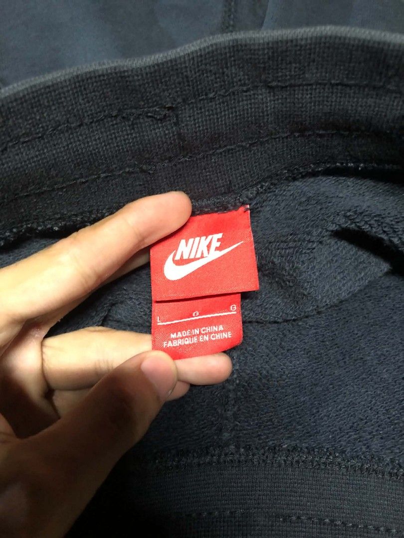 Nike Black Sweatshorts with Drawstring (Category: Shorts) located in Manila. Submitted by thriftnipaps (Listing ID 1469686945, Image 3). Description: - Color: Classic Black - Brand: Nike with embroidered small white swoosh on the left leg - Waistband: Thick ribbed waist with matching adjustable drawstrings - Pockets: Convenient side pockets included - Fabric & Fit: Comfortable, high-quality material ideal for workouts or casual daily wear.