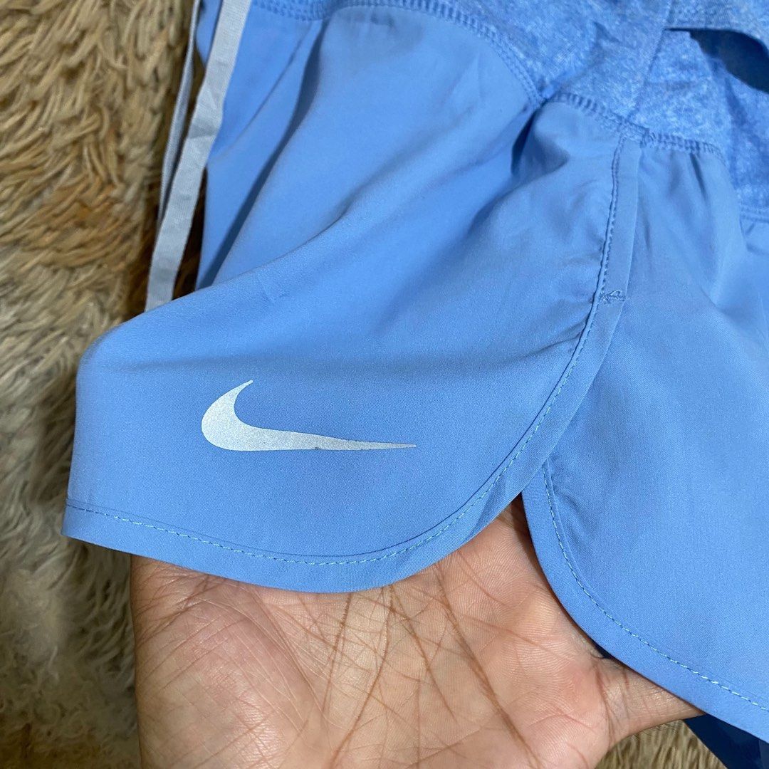 Nike Blue Running Shorts with Zip Pocket (Category: Shorts) located in Butuan. Submitted by jc13thrifts (Listing ID 1469752349, Image 3). Description: - Brand: Nike - Color: Light blue with white Swoosh logo - Waistband: Contrast textured design with drawstring closure - Storage: Convenient zipped pocket at the back - Ideal for: Running, workouts, or casual active wear.